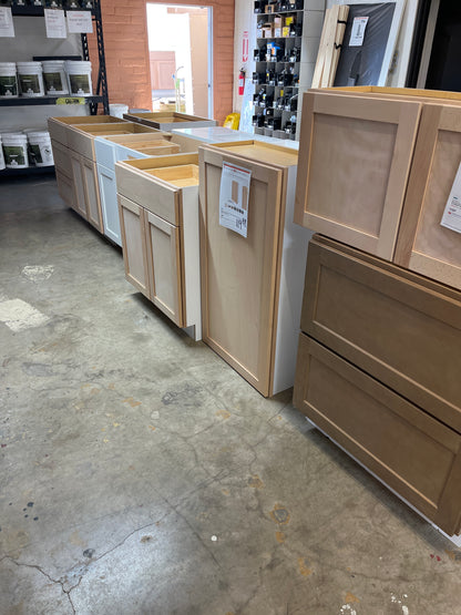 Lots of shaker unfinished birch cabinets
