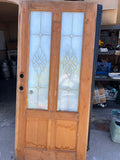 Brass, glass, and wood front door