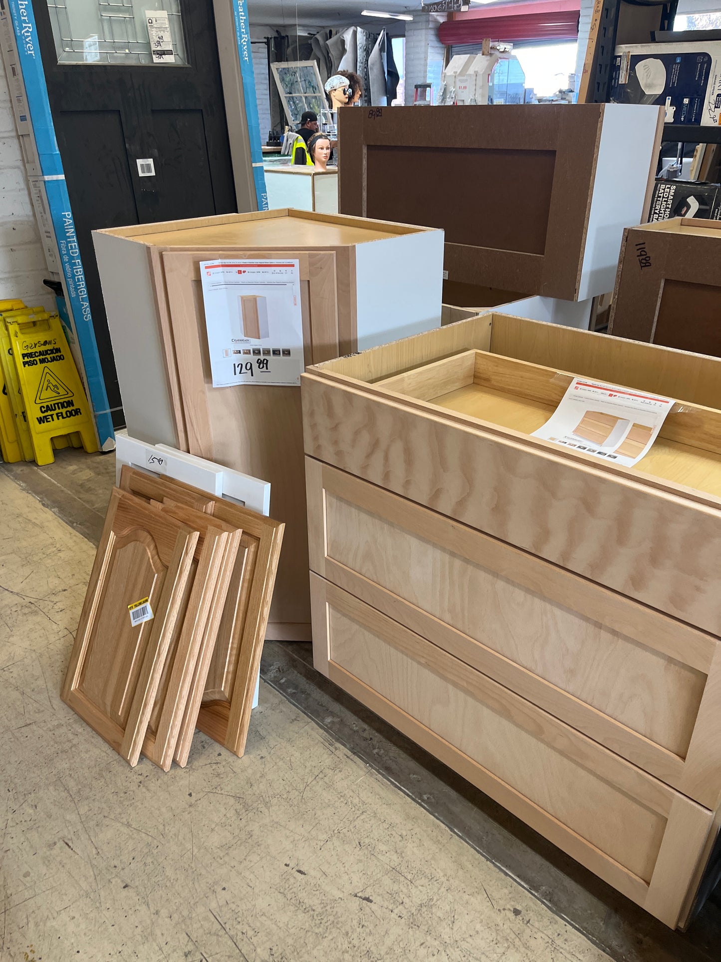 Lots of shaker unfinished birch cabinets
