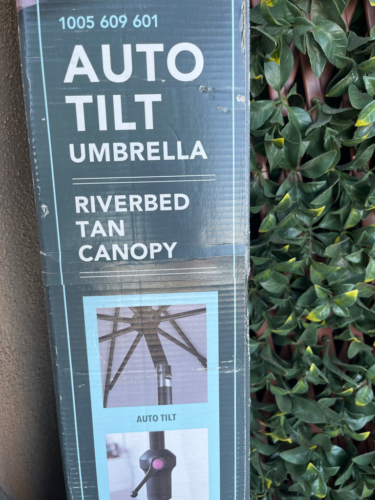 Umbrella with auto tilt