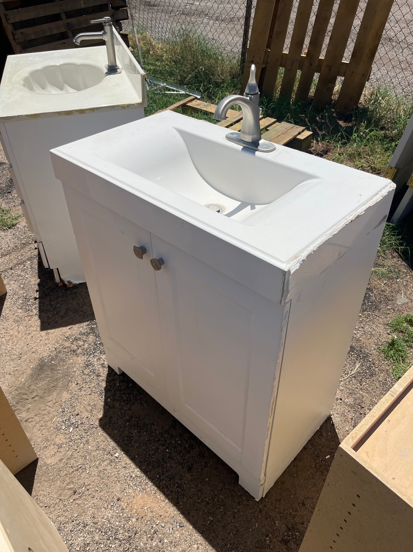 White two door vanity with top and faucet