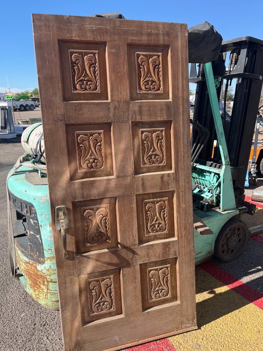 Carved eight panel front door