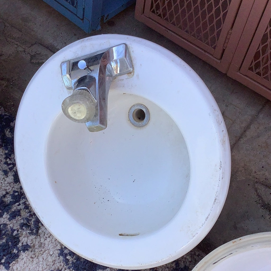 White ceramic sink with faucet